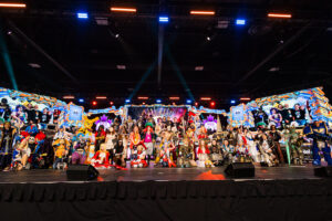People in full cosplay on a stage.