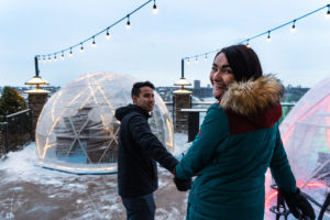 A couple walking into the domes at Courtyard by Marriott.