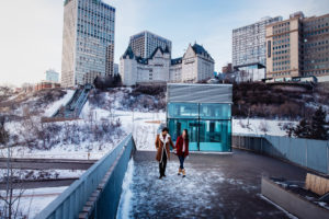 A couple walks along the funicular look-out in winter.