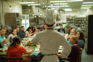 A group of meeting planners experiencing a chef's table experience at the Edmonton Convention Centre