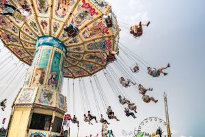 People ride the giant swing at K-days.