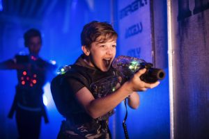 A child plays laser tag.