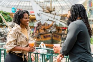 A couple in front of the pirate ship at West Edmonton Mall.