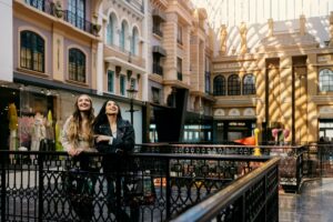 Two people stand in West Edmonton Mall's Europa Boulevard.