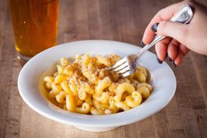 A Mac n Cheese with breadcrumbs sprinkled on.