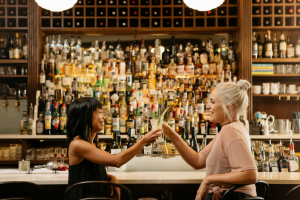 Two women cheers at Bar Clementine.