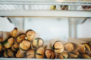 District Cafe Sandwiches stacked in Display case