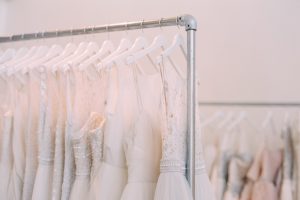 wedding dresses hanging on a rack