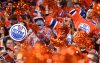 The crowd cheers at an Edmonton Oilers hockey game.