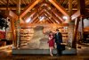 A man and woman stand in the lobby at the Sawridge Inn Hotel