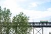 The high level bridge street car crosses the top of the bridge in summer