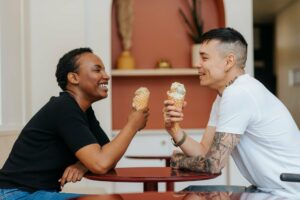 Two people enjoy ice cream.