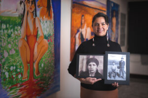 Lana of Whiskeyjack Art House holds photos of her grandparents.