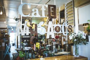 The sign and storefront at Cafe Mosaics.