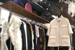 Coats on a clothing rack at Blogger Armoire boutique.