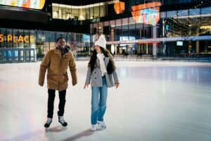 A couple skates at the ICE District's outdoor rink.