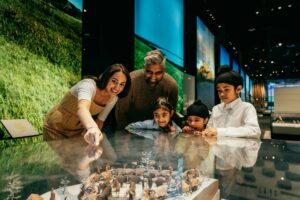 A family admires a display at the Royal Alberta Museum.