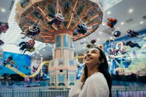 A woman stands in Galaxyland.