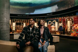 A couple sits in the Royal Alberta Museum.