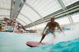 A man surfs in West Edmonton Mall's World Waterpark.