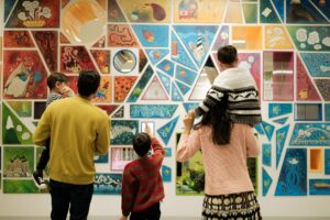 A family admires a display.