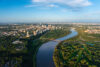 aerial cityscape of Edmonton's skyline and river valley in the summer