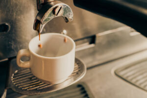 Espresso being poured into a coffee cup at Block 1912, an Edmonton coffee shop.